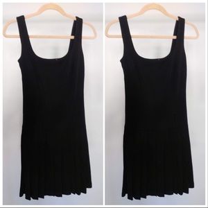 Black dress with pleated bottom.